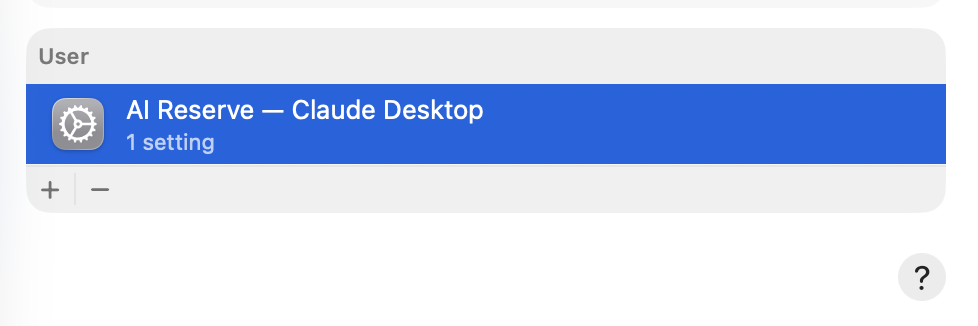 macOS Device Management showing the AI Reserve — Claude Desktop profile installed under User with 1 setting